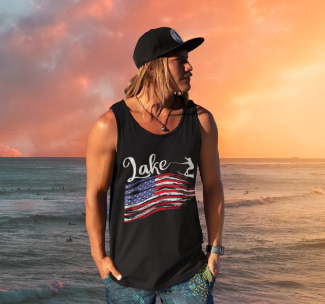 man in sunset wearing black tank top with red, white and blue American flag and wake boarder.